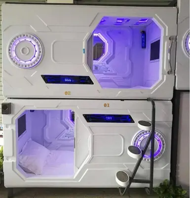 a toy refrigerator with purple lights on it at Belgrade Airport Space Capsule Beds in Bukorovac