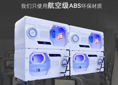 a white machine with blue seats on a table at Belgrade Airport Space Capsule Beds in Bukorovac