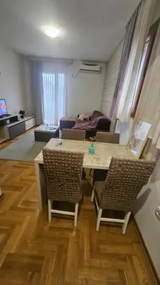 a living room with a table and chairs and a couch at Vera Solaris in Vrnjci