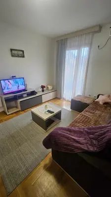 a living room with two beds and a television at Vera Solaris in Vrnjci