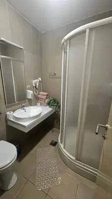 a bathroom with a shower and a sink and a toilet at Vera Solaris in Vrnjci