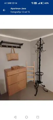 a picture of a room with a desk and a tripod at Apartman Poirot in Kuršumlija