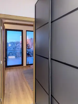 a sliding door with a mirror in a room at Tara mountain house Kopaonik in Kopaonik