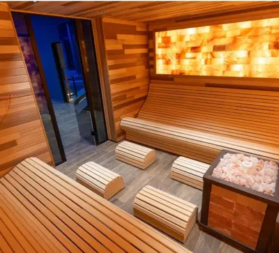 a sauna with three benches in a room at E&E Apartman in Kopaonik