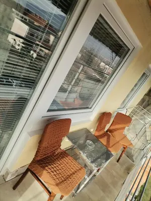 two chairs sitting in front of a window at Mala Sirena in Bukorovac