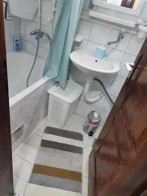 a bathroom with a sink and a tub and a toilet at Mala Sirena in Bukorovac