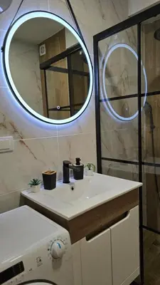 a bathroom with a sink and a mirror at Panoramic Nest in Vrnjačka Banja