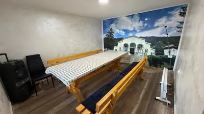 a room with a bed and a mural on the wall at Vilasukovo