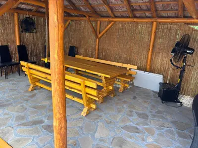 a large group of wooden benches in a hut at Vilasukovo