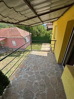 an outdoor patio with awning on a house at Vilasukovo