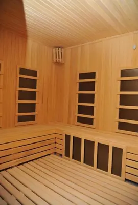 an empty sauna with wooden walls and ceilings at Mountain View President Kop in Kopaonik