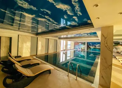 a house with a swimming pool and a swimming pool at Mountain View President Kop in Kopaonik