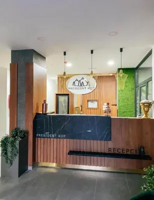 a restaurant with a blue counter in a building at Mountain View President Kop in Kopaonik