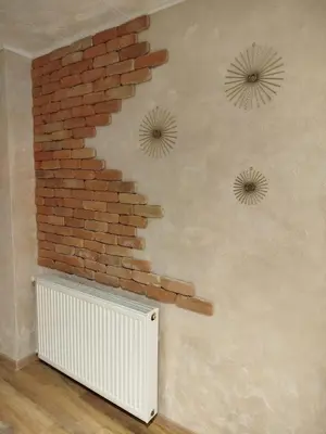 a room with a brick wall and a radiator at Relax URBAN Life in Zaječar