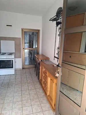 a kitchen with a table and a stove top oven at Nature Nest Više Selo in Blace