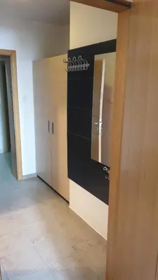 a locker room with a black and white wall at Zoned spa aparman in Kopaonik
