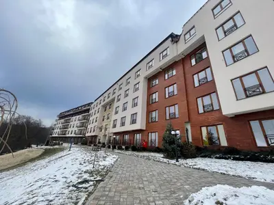 a row of apartment buildings in the snow at Apartman AniLu Milmari Resort N40 in Kopaonik