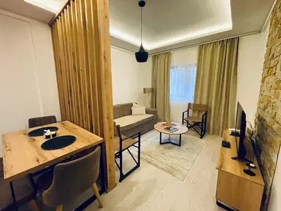 a living room with a couch and a table at Apartman AniLu Milmari Resort N40 in Kopaonik