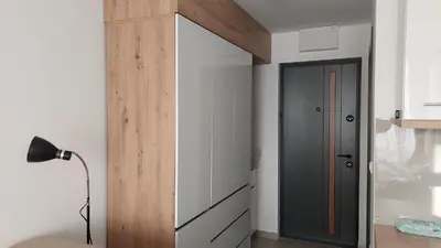 a room with a door and a lamp in a room at Kopaonik Alibi25 in Kopaonik