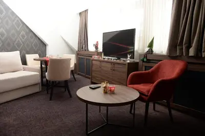 a living room with a couch and a table at Deluxe Studio 19, Kula, Konaci, Kopaonik