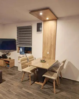 a dining room with a table and chairs at Suncani breg in Crni Vrh