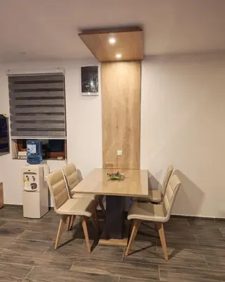 a dining room with a table and chairs at Suncani breg in Crni Vrh