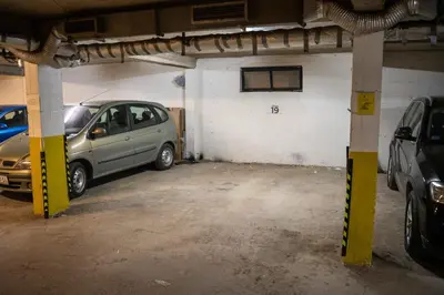 a parking garage with a car parked in it at Apartman Nana in Vranje