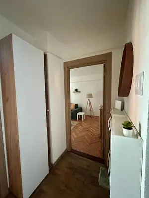 a hallway with a door leading to a living room at Tilia in Zaječar