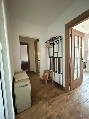 an empty living room with a room with a box at Tilia in Zaječar