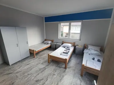 a small room with two beds and a window at Tara in Surdulica