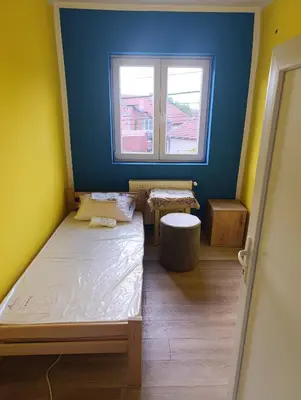 a small room with a bed and a window at Tara in Surdulica