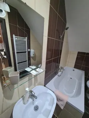 a bathroom with a sink and a mirror at VILA KRUNA Apartments in Kopaonik
