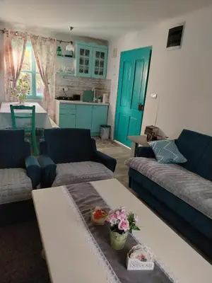 a living room with two couches and a table at Šumarac