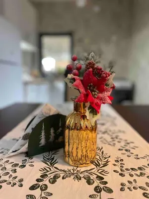a vase with flowers in it sitting on a table at Ćilibar Stara planina in Crni Vrh
