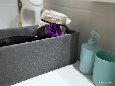 a bottle of wine and a flower in a box at Apartman Vidačić in Pirot