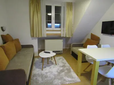 a small living room with a couch and a table at BeleStaze88 in Brzeće
