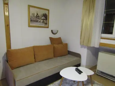 a living room with a couch and a table at BeleStaze88 in Brzeće