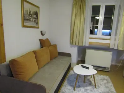 a living room with a couch and a table at BeleStaze88 in Brzeće
