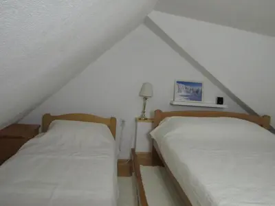two beds in a room with a roof at BeleStaze88 in Brzeće