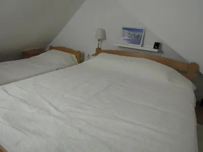a bedroom with two beds with white sheets at BeleStaze88 in Brzeće