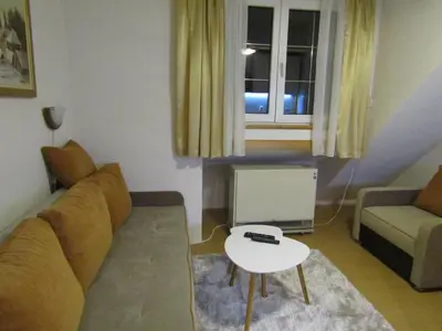 a living room with a couch and a table at BeleStaze88 in Brzeće