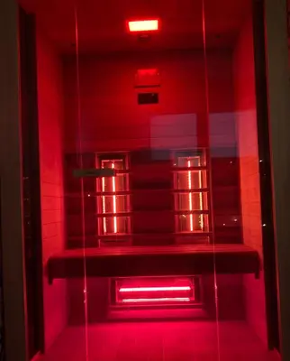 a red light in a room with a shelf at Star&spa in Niš