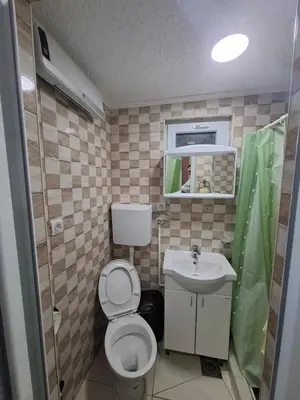 a small bathroom with a toilet and a sink at PODNOZJe KOPAONIKA in Brus