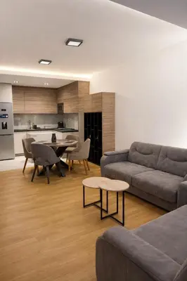 a living room with a couch and a table at Leo Lux 3 in Niš