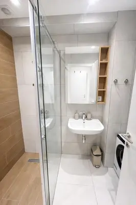 a bathroom with a sink and a shower at Leo Lux 3 in Niš