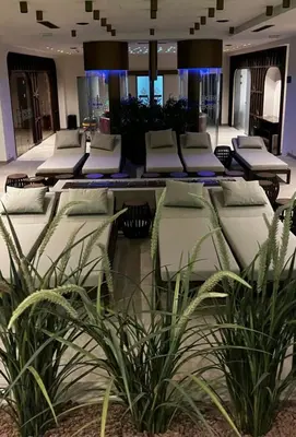 a room with several yoga mats and plants at Planet Residence Deluxe Wellnes & Spa Apartment in Niš