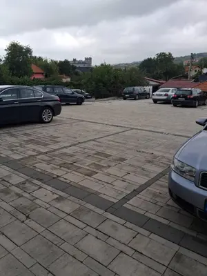 a parking lot with several cars parked in it at Onix 1 in Soko Banja