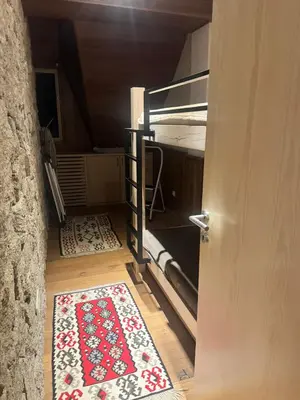 an open door to a room with a rug on the floor at Top Hill - Župa Kopaonik in Kopaonik