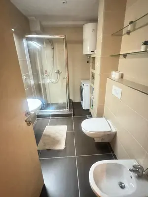 a bathroom with a shower and a toilet and a sink at Top Hill - Župa Kopaonik in Kopaonik