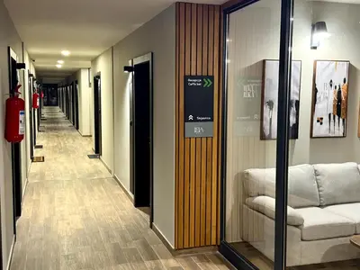 a hallway with a couch in a building at Apart-Hotel Bela Reka in Brzeće